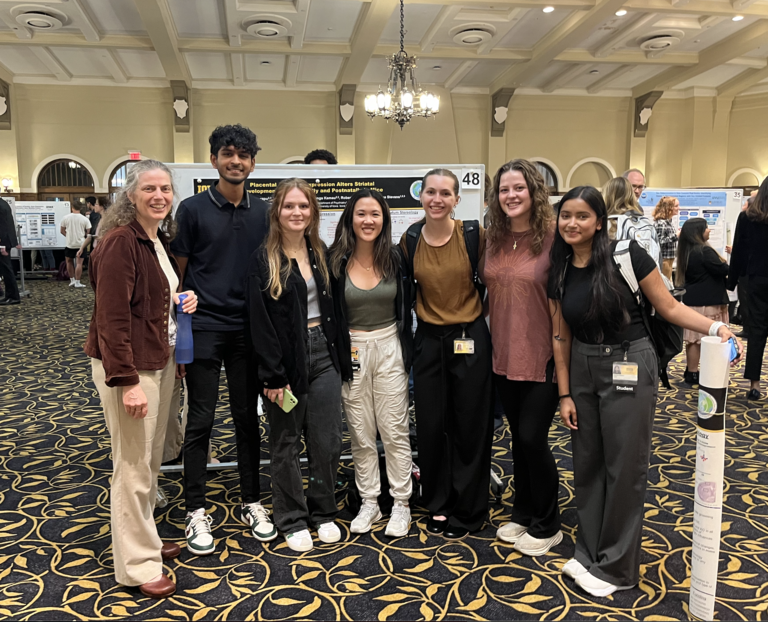 picture of lab members at an undergraduate poster session