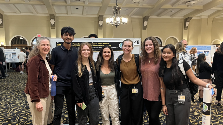 picture of lab members at an undergraduate poster session